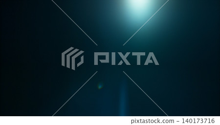 Anamorphic lens flare and light leak effect on dark background. Minimal cinematic optical texture ideal for overlays, film production, motion graphics and visual effects. 140173716