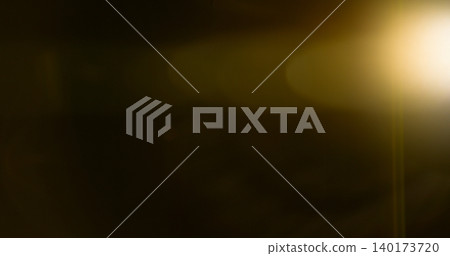 Anamorphic lens flare and light leak effect on dark background. Minimal cinematic optical texture ideal for overlays, film production, motion graphics and visual effects. 140173720