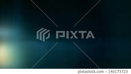 Anamorphic lens flare and light leak effect on dark background. Minimal cinematic optical texture ideal for overlays, film production, motion graphics and visual effects. 140173723