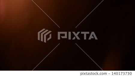 Abstract cinematic lens flare with soft bokeh circles and subtle light reflections. Atmospheric optical effect background ideal for overlays, visual effects, film production and creative design. 140173730