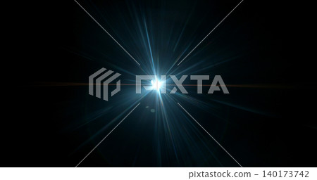 Intense cinematic light flare radiating from a bright source on dark background. Realistic optical effect ideal for film production, visual effects and dramatic compositions. 140173742