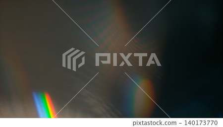 Abstract RGB prism lens flare with colorful light refraction and optical distortion. Creative cinematic background suitable for visual effects, overlays and modern digital design. 140173770
