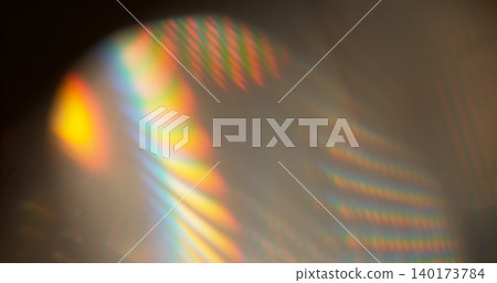 Abstract RGB prism lens flare with colorful light refraction and optical distortion. Creative cinematic background suitable for visual effects, overlays and modern digital design. 140173784