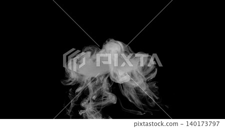 Detailed white smoke formation isolated on black background. Abstract swirling vapor with realistic texture and smooth flowing shapes, ideal for creative design, overlays and visual effects. Detailed white smoke formation isolated on black background. Abstract swirling vapor with realistic texture and smooth flowing shapes, ideal for creative design, overlays and visual effects. 140173797
