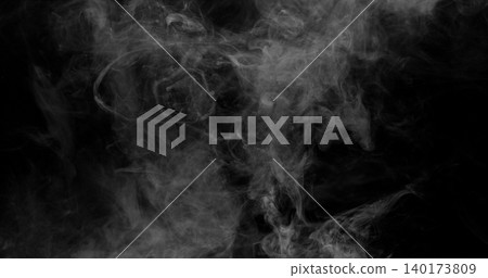 Delicate white smoke wisps drifting across a dark background. Atmospheric abstract texture with soft swirling patterns, ideal for creative design, overlays and visual effects projects. 140173809