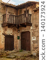 Weathered Stone Facade with Windows in a Spanish Village 140173924