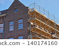Renovation in City Center Showcasing Dutch Architecture Against a Bright Blue Sky 140174160