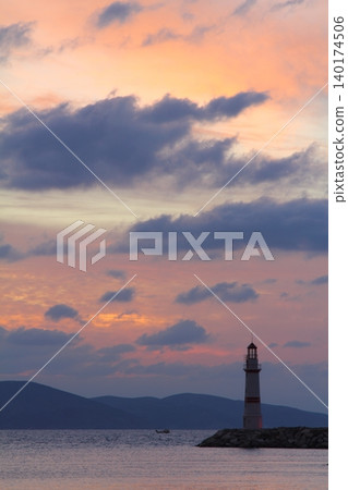 Seascape at sunshine. Lighthouse and sailings on the coast. Seaside town of Turgutreis and spectacular sunshine 140174506