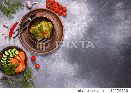 Traditional stuffed cabbage rolls served on clay plate Traditional stuffed cabbage rolls served on clay plate 140174708