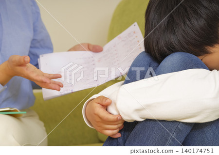 An overly enthusiastic mother and a reluctant child An overly enthusiastic mother and a reluctant child 140174751