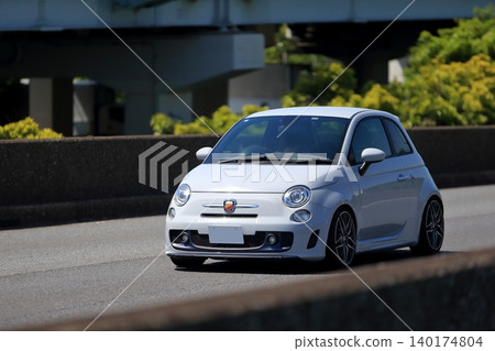 Image of a white Italian compact sports car Image of a white Italian compact sports car 140174804