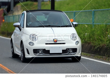 Image of a white Italian compact sports car Image of a white Italian compact sports car 140174805