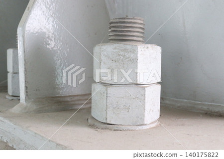 The image features large, thick anchor bolts The image features large, thick anchor bolts 140175822