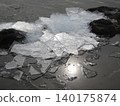 Thin ice glittering on the shores of Lake Suwa 140175874