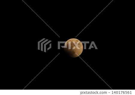 The moon heading towards a total lunar eclipse (photographed in 2022) 140176561