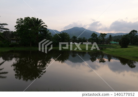Tropical Palm Plantation Landscape in Thailand with Green Hills Tropical Palm Plantation Landscape in Thailand with Green Hills 140177052
