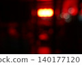 Abstract Red Bokeh Lights Background in Urban Night Scene 140177120