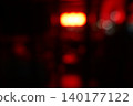 Abstract Red Bokeh Lights Background in Urban Night Scene 140177122