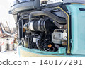 Inside the engine compartment of a small construction machine 140177291