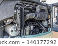 Inside the engine compartment of a small construction machine 140177292