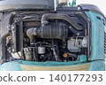 Inside the engine compartment of a small construction machine 140177293