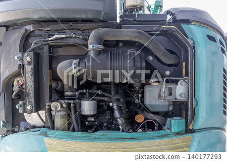 Inside the engine compartment of a small construction machine Inside the engine compartment of a small construction machine 140177293