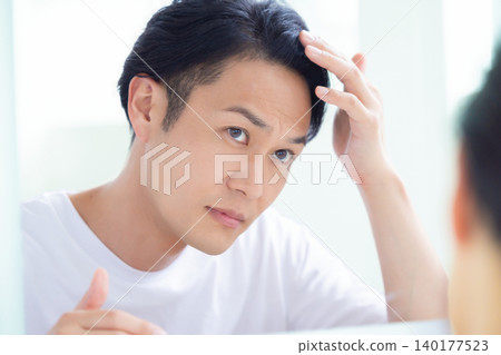 Beauty image: Middle-aged man looking in the mirror Beauty image: Middle-aged man looking in the mirror 140177523