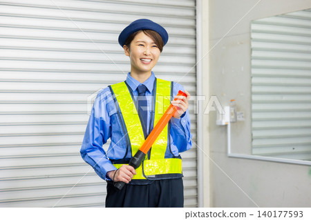 Security guard to guide traffic Security guard to guide traffic 140177593