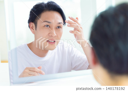 Beauty image: Middle-aged man looking in the mirror Beauty image: Middle-aged man looking in the mirror 140178192