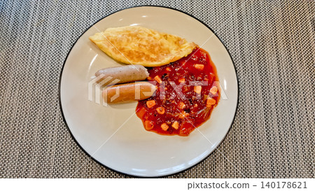 close up photo of sausage snacks, omelet and red bean soup 140178621