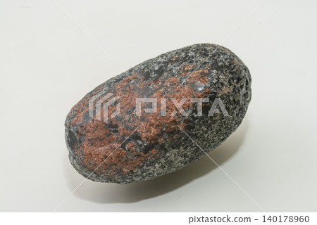 A single stone block against a white background. A single stone block against a white background. 140178960