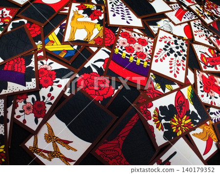A competition of Hanafuda cards depicting flowers of the four seasons A competition of Hanafuda cards depicting flowers of the four seasons 140179352