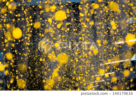 a wall of tiny golden glowing lights hanging everywhere. looks like stars or a magic curtain. great for holiday backdrop a wall of tiny golden glowing lights hanging everywhere. looks like stars or a magic curtain. great for holiday backdrop 140179616
