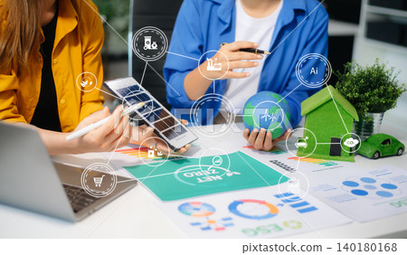 businesspeople in team meeting for ESG focused business team discussing sustainability, net zero goals 140180168