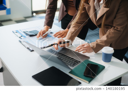 Business People Planning Strategy Analysis Office Concept. writing notes about sticky notes Laptop Business People Planning Strategy Analysis Office Concept. writing notes about sticky notes Laptop 140180195