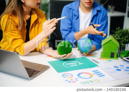 businesspeople in team meeting for ESG focused business team discussing sustainability, net zero goals businesspeople in team meeting for ESG focused business team discussing sustainability, net zero goals 140180198