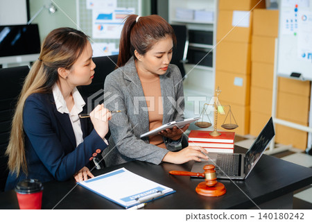 Business and Male lawyer or judge consult having team meeting with client, Law and Legal services concept. Business and Male lawyer or judge consult having team meeting with client, Law and Legal services concept. 140180242