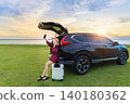 Tourists are enjoying taking selfies in open car boot. Travelling concept. 140180362