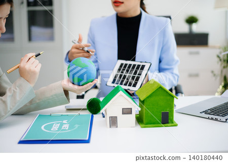 Business team working virtual modern smartphone to reduce CO2 emissions carbon footprint climate change to limit global warming Business team working virtual modern smartphone to reduce CO2 emissions carbon footprint climate change to limit global warming 140180440