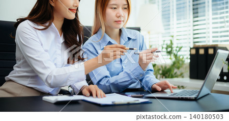 Business team collaboration discussing working analyzing with financial data and marketing growth report graph in team, presentation and digital tablet, laptop. Business team collaboration discussing working analyzing with financial data and marketing growth report graph in team, presentation and digital tablet, laptop. 140180503
