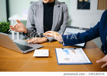 Business team collaboration discussing working analyzing with financial data and marketing growth report graph in team, presentation and digital tablet, laptop. 140180534