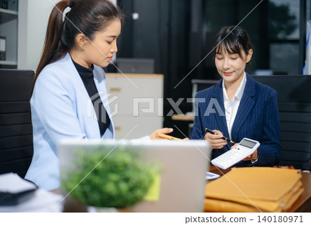 Professional female lawyers consulting on legal cases in a modern office. Perfect for law, business, justice 140180971