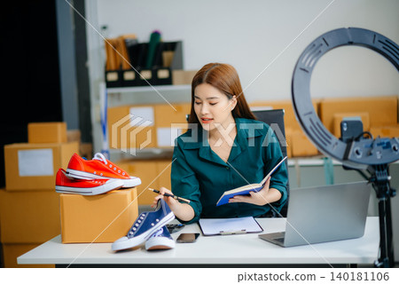 Businesswoman preparing product shipments. Highlighting creativity, entrepreneurship, and the small business journey 140181106