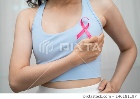 Breast cancer, pink ribbon at Asian senior lady for supporting awareness, symbol of World Breast Cancer Day. Breast cancer, pink ribbon at Asian senior lady for supporting awareness, symbol of World Breast Cancer Day. 140181197