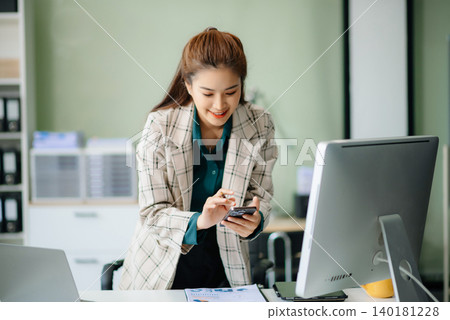Woman freelancer is working her job on computer tablet and laptop Doing accounting analysis report real estate investment Woman freelancer is working her job on computer tablet and laptop Doing accounting analysis report real estate investment 140181228