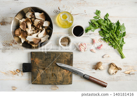 Oyster mushrooms cooked in air fryer with oil, garlic, and herbs in a kitchen setting Oyster mushrooms cooked in air fryer with oil, garlic, and herbs in a kitchen setting 140181416