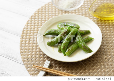 Roasted snap peas with olive oil and salt Roasted snap peas with olive oil and salt 140181551