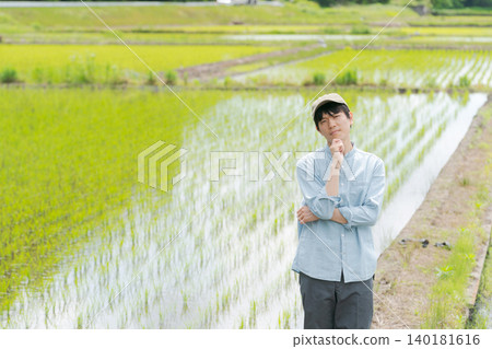 Young farmers planting rice 140181616