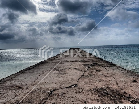 The beautiful sea and dramatic sky viewed from the west pier of Taketomi Island, Okinawa. The beautiful sea and dramatic sky viewed from the west pier of Taketomi Island, Okinawa. 140181631