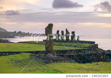 Stoic peaceful moai statue at sunset on easter island chile coast Stoic peaceful moai statue at sunset on easter island chile coast 140181803